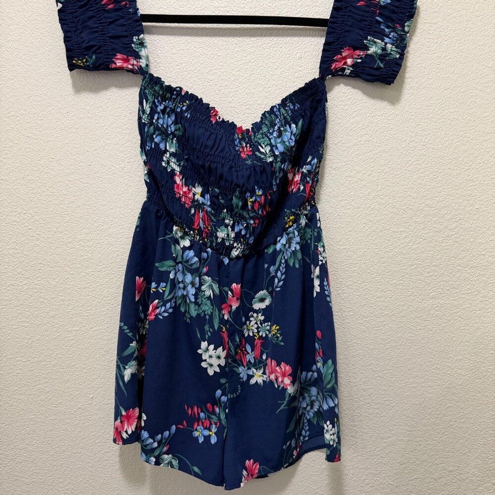 Sienna Sky blue floral shorts romper with ruched cold shoulder, back tie, small